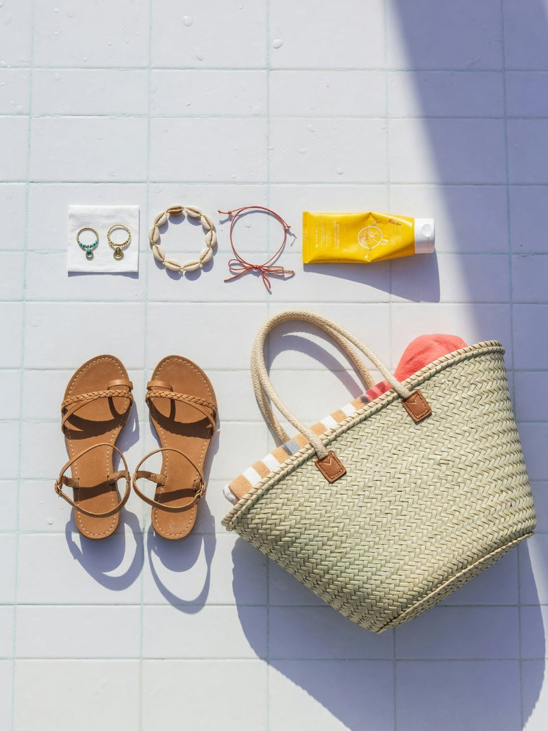 Sandal season foot jewelry checklist flat lay by the pool