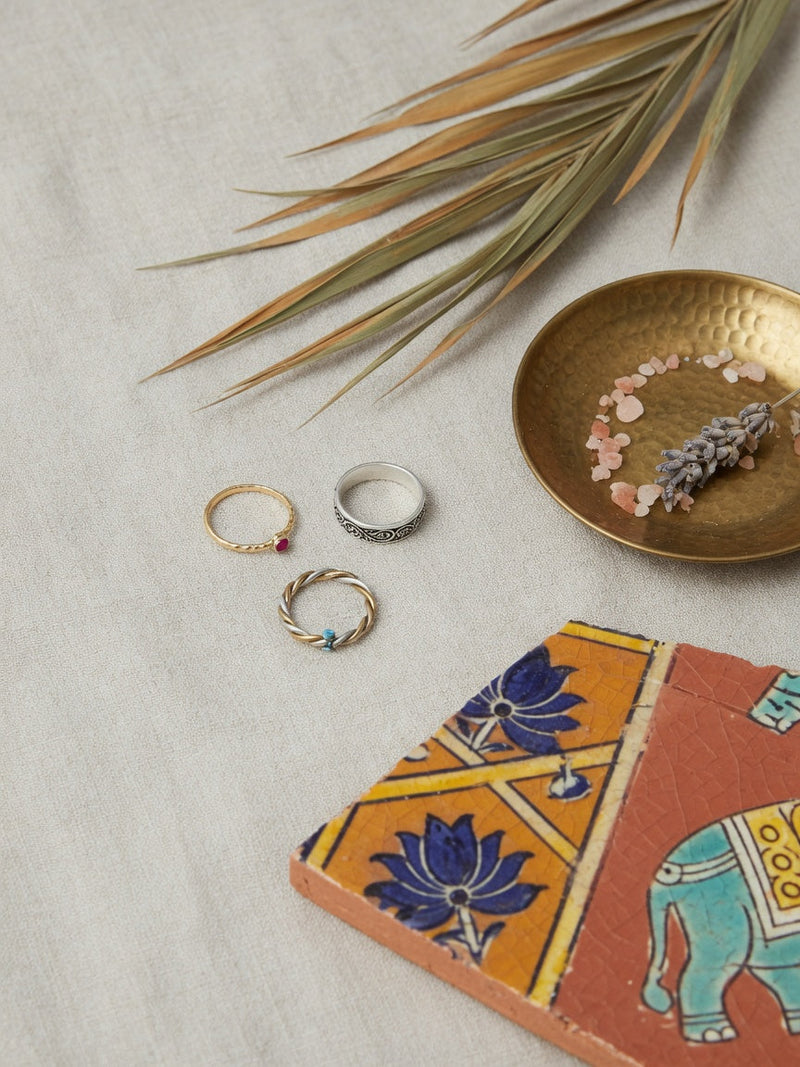 Global toe ring editorial still life, gold and silver foot jewelry